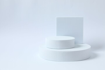 Props for product photography. Different podiums on a white background