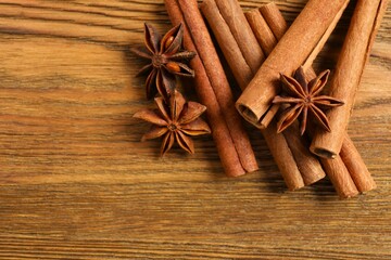 Aromatic cinnamon and anise stars on a wooden background