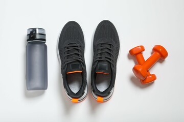 Sport equipment on gray background, top view