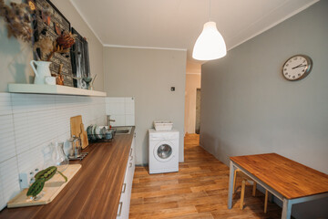 A spacious, cozy, simple kitchen in the apartment. No one, no people.