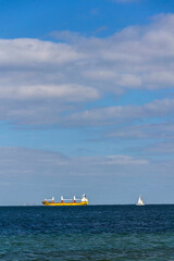 Container ship on sea with copy space on heaven and water, sunny day