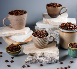 Fresh coffee beans in a mug and background.