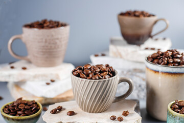 Fresh coffee beans in a mug and background.