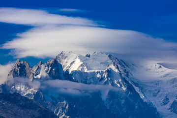 Mont Blanc, Monte Bianco mountain summit in the Alps. The highest mountain in Europe. Snow and glacier covered high altitude snow mountain in the Alps. The top of Montblanc Chamonix valley landscape