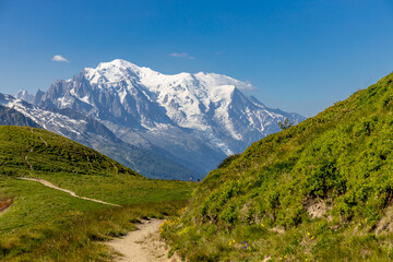Obraz premium Mont Blanc, Monte Bianco mountain summit in the Alps. The highest mountain in Europe. Snow and glacier covered high altitude snow mountain in the Alps. The top of Montblanc Chamonix valley landscape