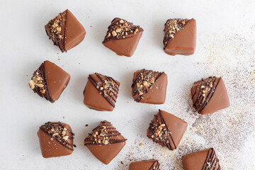 Handmade chocolate with pistachios, dark and milk chocolate pieces.