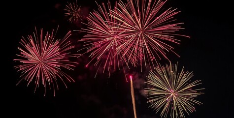 Obraz premium Golden Fireworks - Countdown To Midnight - Abstract Defocused Background. 2025 New Year’s Eve Countdown Fireworks