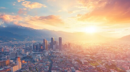 Fototapeta premium A vibrant sunset over a sprawling city skyline with mountains in the background.