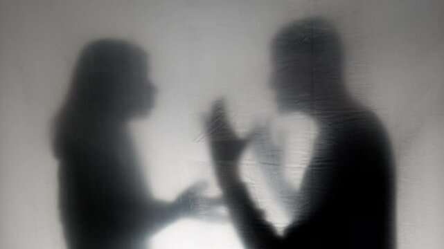 Domestic violence concept. Aggressive man argues and grabs woman by the neck. Husband beats wife. Family quarrel.