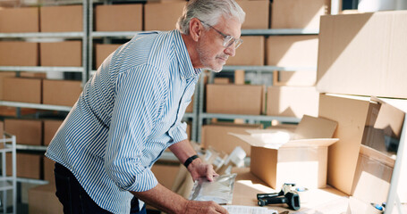 Box, computer and supply chain with business man in office for delivery or distribution tracking. Logistics, planning and typing with mature employee in workplace for cargo or shipping management