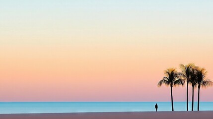   A person stands on a beach with two palm trees in the foreground and a body of water in the background