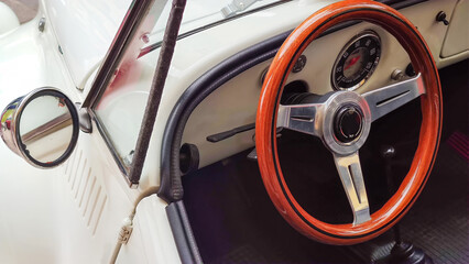 Vintage Italian Car Interior with Wooden Steering Wheel and Dashboard