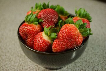 Fresh Strawberries in a Black Bowl