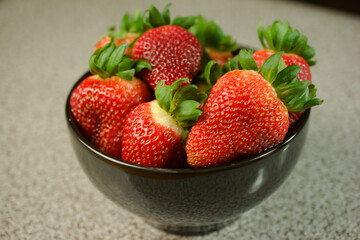 Fresh Strawberries in a Black Bowl