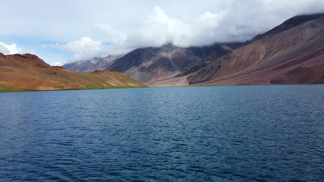 Aerial view of chandratal lake surrounded by snow-capped Himalayan mountains at chandratal in lahaul and spiti valley himachal pradesh, India.