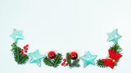 Christmas greeting card. Frame of spruce twigs, Christmas decorations and toy on white background.