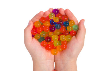 Water coloured gel balls on hand. Isolated on white. Orbeez.