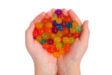 Water coloured gel balls on hand. Isolated on white. Orbeez.