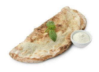 Delicious calzone with sauce and fresh basil isolated on white
