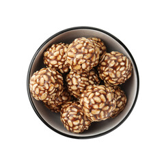 Delicious chocolate puffed rice balls in bowl isolated on white, top view