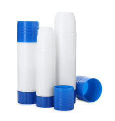 Many different glue sticks isolated on white
