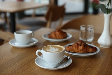 Delicious breakfast served on wooden table in cafe