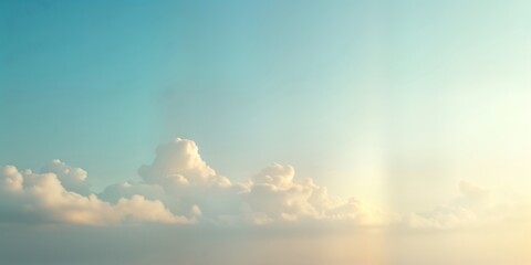 Soft pastel light blue, beige sky gradient background with fluffy clouds. Soft light shows through clouds. Ideal for minimalist designs. Looks like sunrise sunset. Calming, serene backdrop. Perfect