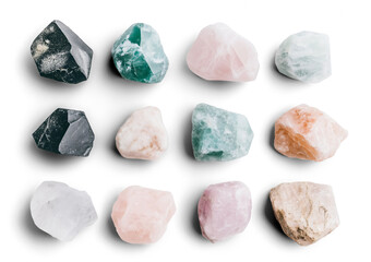 Naklejka premium Varied collection of natural stones showcasing unique colors and textures arranged artistically on a white background