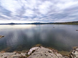 Lead clouds reflect in a cold lake Bukhtarma