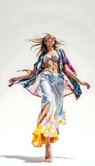 Fototapeta premium Young beautiful dancer posing in studio, wearing colorful dress and sunglasses.