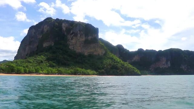 Go by boat trip limestone cliffs and turquoise waters Thailand.