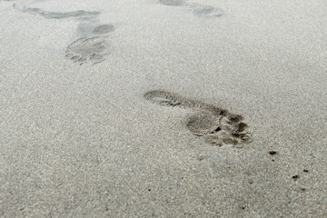 Human footprints on the beach sand. footprint marks
