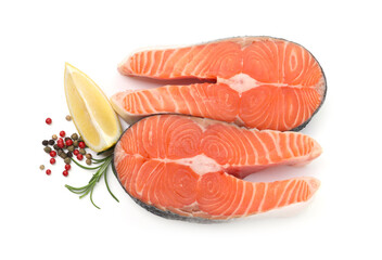 Fresh raw salmon steaks and spices isolated on white, top view