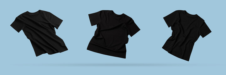 Black t-shirts in air on light blue background