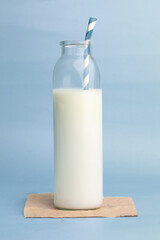 bottle of milk on blue background