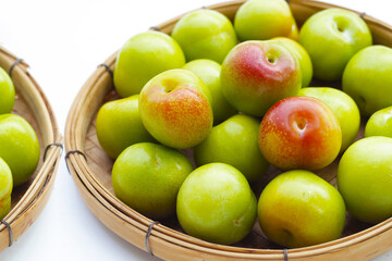 Fresh green plum on white background