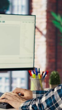 Software engineer at computer coding, creating software using isolated screen tablet. IT specialist in home office working with code editor, building applications using PC and mockup device, camera B