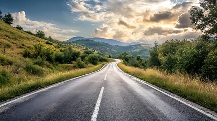 Naklejka premium Scenic Mountain Road at Sunset. Concept of Adventure, Freedom, and Travel.