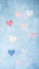 A soft blue background with various pastel hearts scattered across it, conveying a gentle, loving theme.