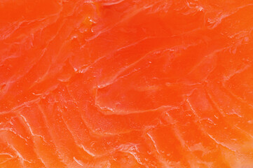 Texture of red salmon fish as background macro photo. Food, fish, omega