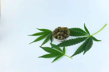 Concept edibles CBD and drinks with cannabis . Glasses with fresh hemp. close up recreation marijuana medical cannabis oil cbd and THC.  Herbal medicine tea with cannabis on white background, emphasiz