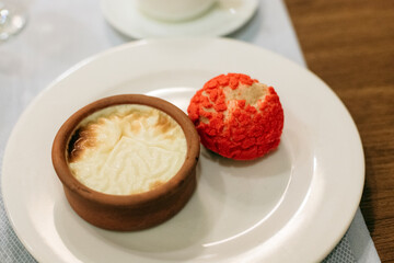 
Vanilla panna cotta in a ceramic dish, cream puff
