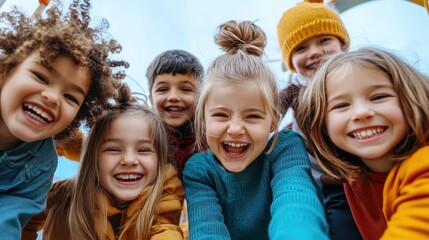 Obraz premium Joyful Group of Children Laughing Together in Outdoor Playground on a Bright Sunny Day