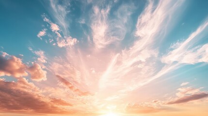 Obraz premium Serene Morning Sky Filled with Wispy Clouds Bathed in Soft Light at Dawn