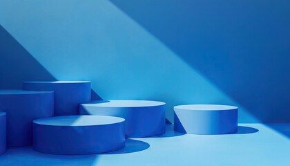 Blue Cylindrical Platforms Against Blue Background