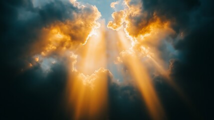 Obraz premium Golden sunlight breaks through dramatic dark storm clouds from heaven that symbolizes hope, strength, and the raw beauty of God in nature