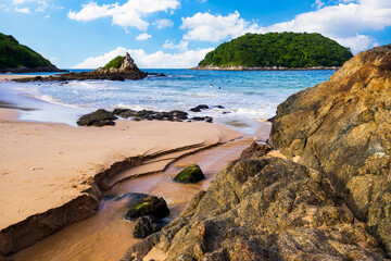  Yanui Beach with rock and blue sky in Phuket Thailand
