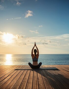 a serene yoga session on a wooden deck overlooking the ocean panorama view
