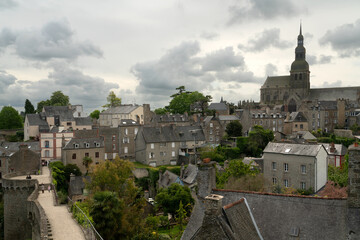 Obraz premium View of the downtown and the Basilica of Saint-Sauveur from the observation deck on the city wall on a summer day, Dinan, Cotes-d'Armor, Brittany, France