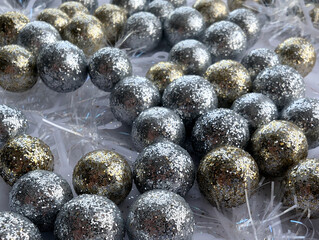 Many small shiny balls and snowflakes. Close up